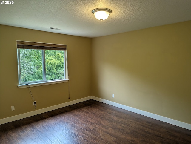 17458 SW Inkster Dr, Sherwood, OR 97140 - empty room featuring dark wood-style floors and a textured ceiling