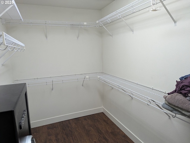 17458 SW Inkster Dr, Sherwood, OR 97140 - walk in closet with dark wood-style flooring