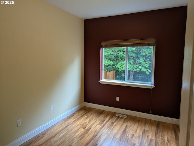17458 SW Inkster Dr, Sherwood, OR 97140 - spare room featuring wood finished floors and baseboards