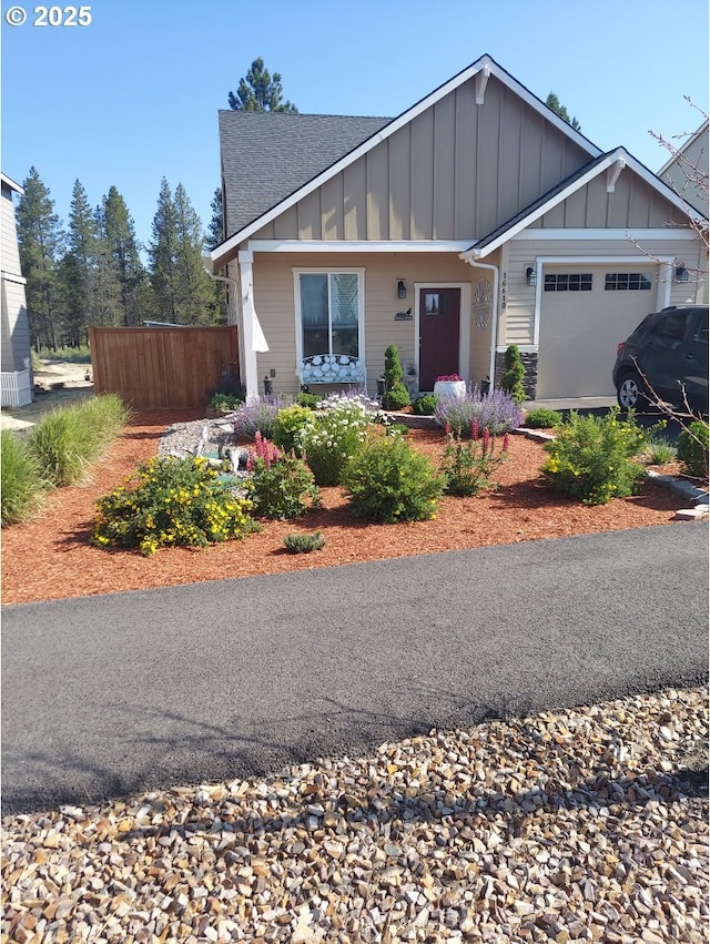 16610 Pine Creek Dr, La Pine, OR 97739 - view of front of house featuring board and batten siding, a garage, and roof with shingles