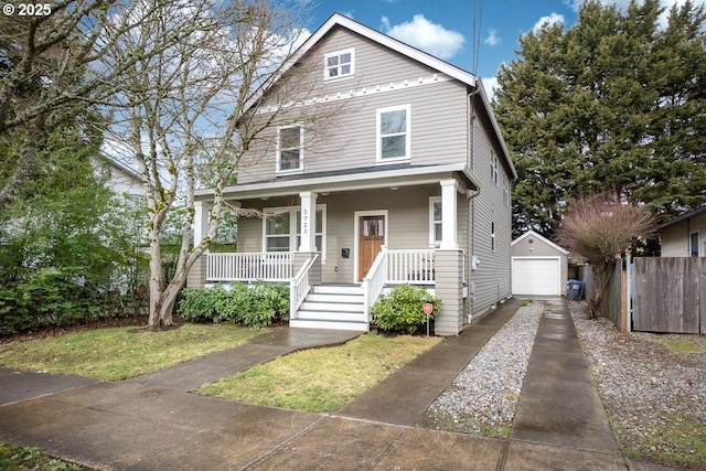 view of front facade featuring a garage, an outdoor structure, and covered porch