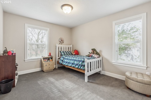 carpeted bedroom with multiple windows