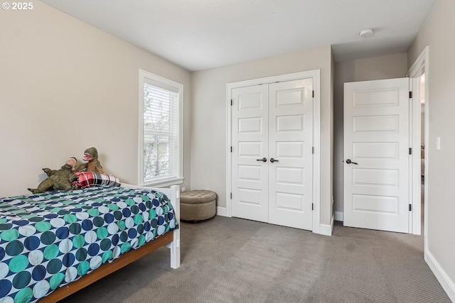 bedroom with a closet and carpet