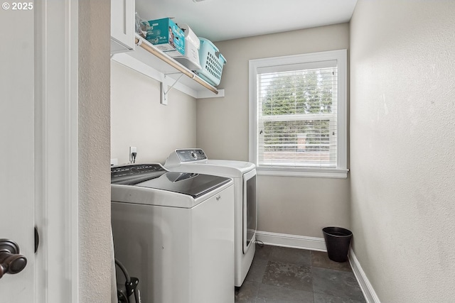 laundry area featuring washing machine and clothes dryer