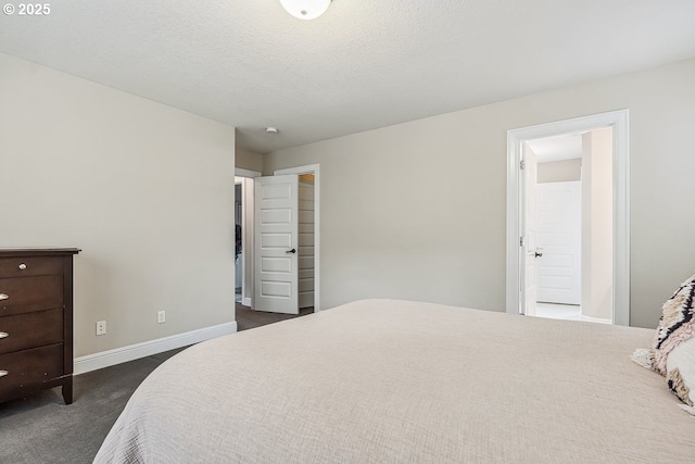 carpeted bedroom featuring a textured ceiling