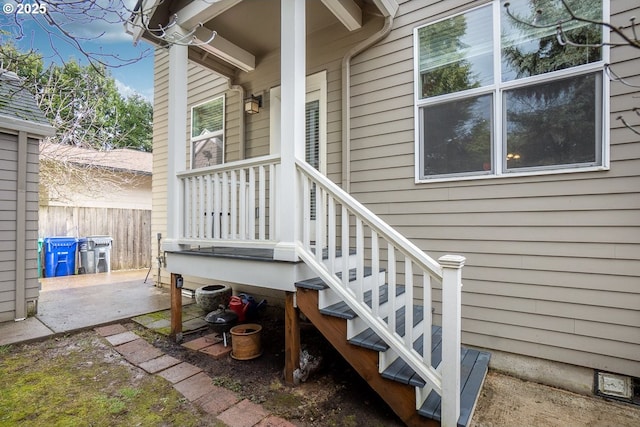 view of exterior entry featuring a patio