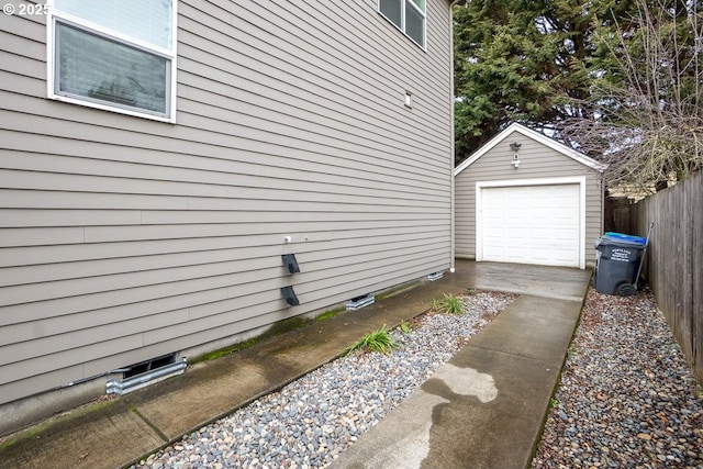 view of side of property with an outbuilding and a garage