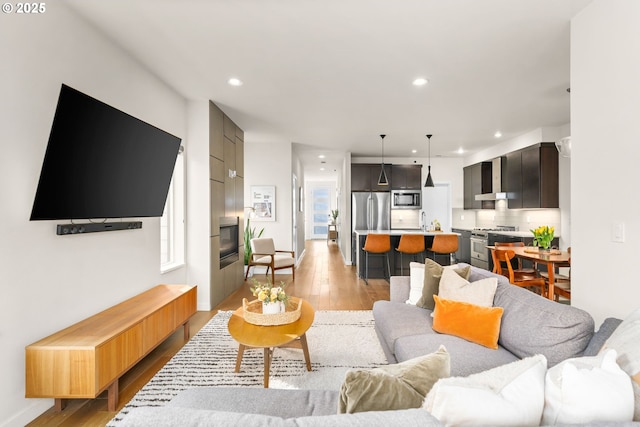 living room featuring light hardwood / wood-style flooring and a wealth of natural light