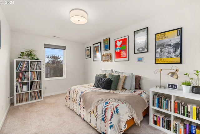 bedroom featuring light carpet