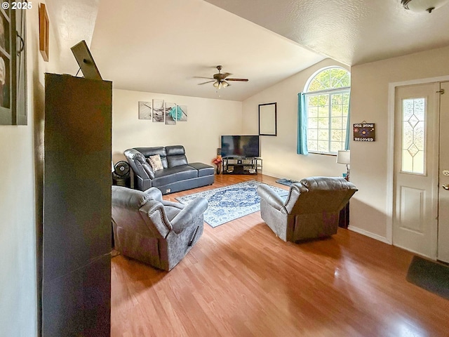 142 NE Stevenson Ct, Myrtle Creek, OR 97457 - living area with wood finished floors, vaulted ceiling, a ceiling fan, and baseboards