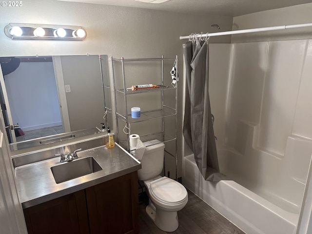 full bath featuring vanity, toilet, wood finished floors, and shower / bath combo with shower curtain