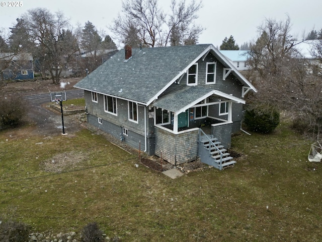 back of house with a yard