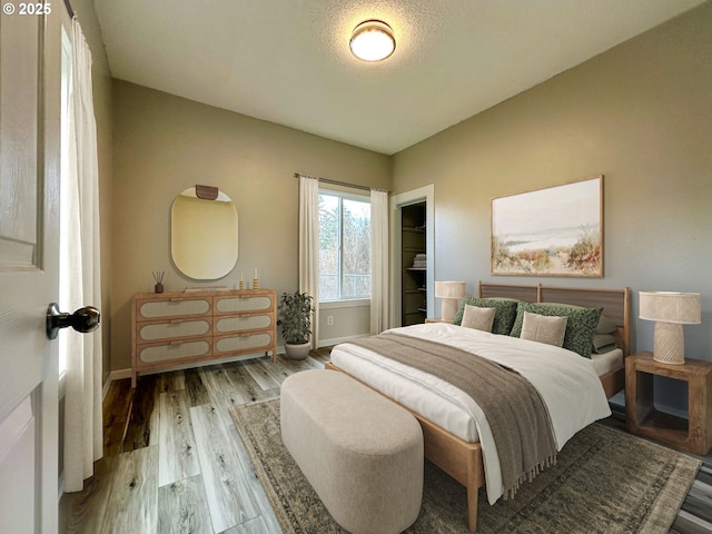 bedroom with light wood-type flooring