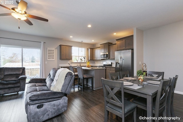 dining area featuring ceiling fan, baseboards, dark wood-type flooring, and recessed lighting