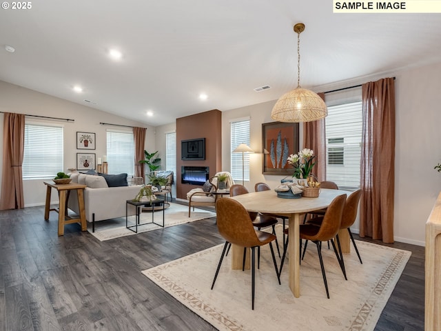 kitchen featuring light countertops, a sink, stainless steel dishwasher, open floor plan, and white cabinets