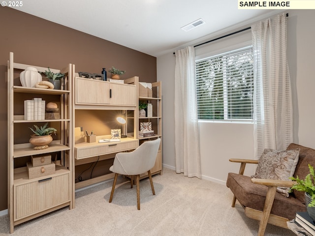 office space with light colored carpet