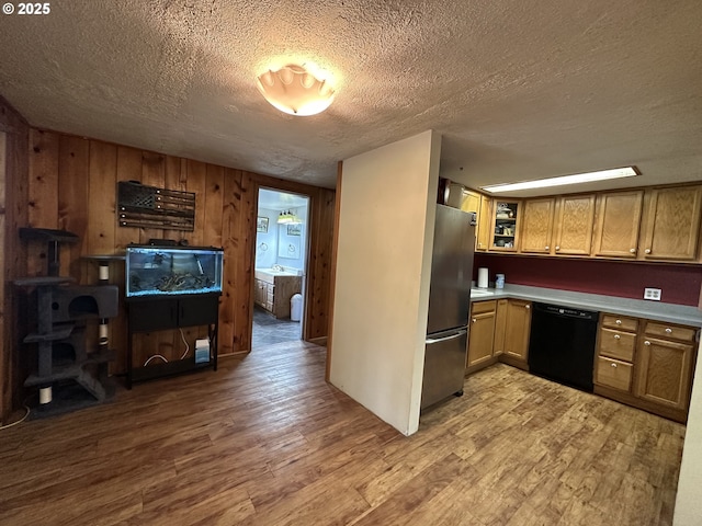 440 N Mountain Blvd, Mount Vernon, OR 97865 - kitchen with dishwasher, freestanding refrigerator, wood finished floors, a textured ceiling, and light countertops