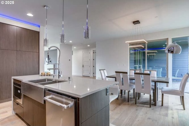 15 Hood St, Camas, WA 98607 - kitchen with dishwasher, modern cabinets, a sink, light countertops, and recessed lighting