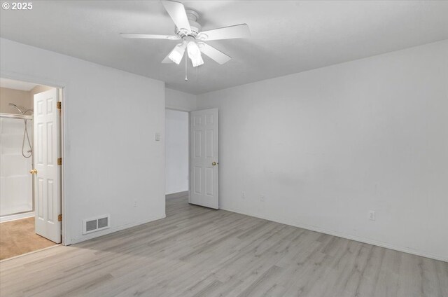 empty room featuring wood finished floors, ceiling fan, and baseboards