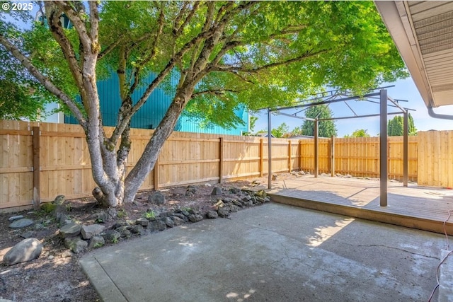 view of patio / terrace with a fenced backyard and a deck