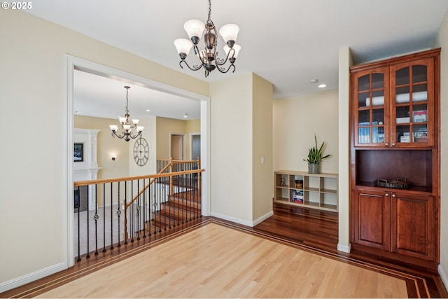1145 NW 22nd Ave, Camas, WA 98607 - unfurnished room featuring a chandelier, wood finished floors, recessed lighting, and baseboards
