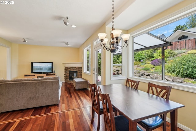 1145 NW 22nd Ave, Camas, WA 98607 - dining room with plenty of natural light, wood finished floors, a chandelier, and a fireplace