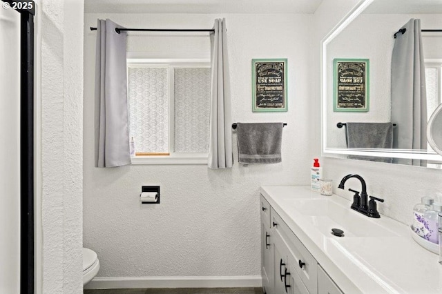 3060 Pine St, North Bend, OR 97459 - bathroom featuring vanity, toilet, and a textured wall
