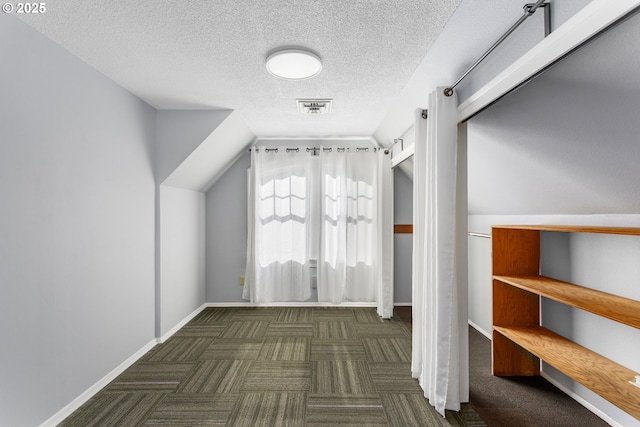 2125 NE 48th Ave, Portland, OR 97213 - additional living space featuring carpet flooring, a textured ceiling, lofted ceiling, and baseboards