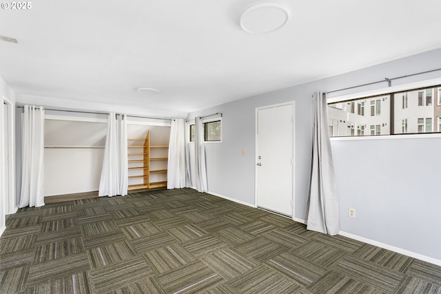 2125 NE 48th Ave, Portland, OR 97213 - unfurnished bedroom featuring dark colored carpet, two closets, and baseboards