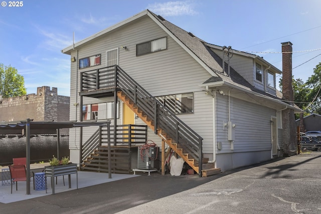 2125 NE 48th Ave, Portland, OR 97213 - back of property featuring stairs and a shingled roof