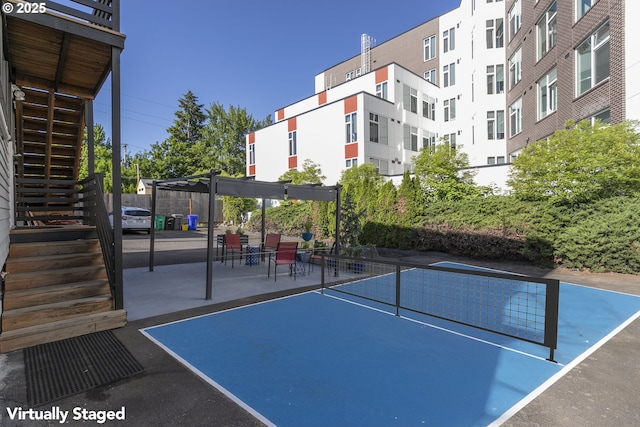 2125 NE 48th Ave, Portland, OR 97213 - view of community with stairs, a pergola, a tennis court, and a patio area