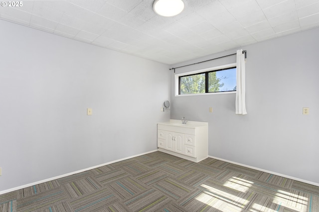 2125 NE 48th Ave, Portland, OR 97213 - carpeted empty room with a sink and baseboards