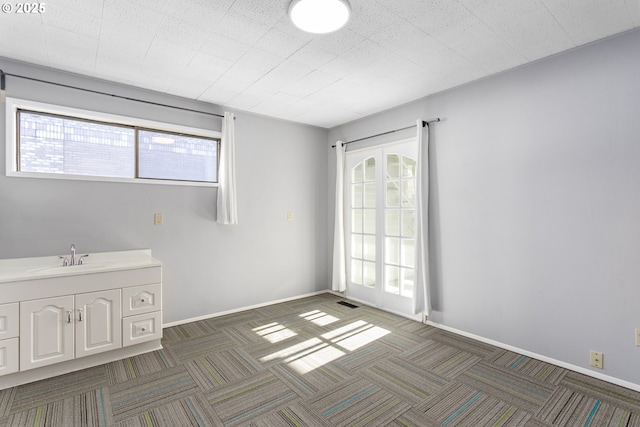 2125 NE 48th Ave, Portland, OR 97213 - carpeted spare room featuring a sink and baseboards