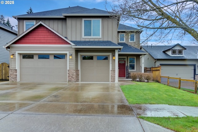 4219 NE 157th Ct, Vancouver, WA 98682 - craftsman-style home with board and batten siding, fence, stone siding, and concrete driveway