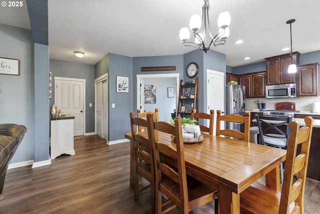 4219 NE 157th Ct, Vancouver, WA 98682 - dining space with a chandelier, baseboards, and dark wood-style floors