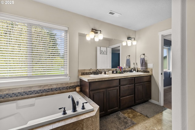 4219 NE 157th Ct, Vancouver, WA 98682 - full bathroom featuring a healthy amount of sunlight, a sink, and a garden tub
