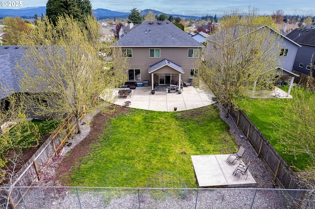 4219 NE 157th Ct, Vancouver, WA 98682 - rear view of house with a patio area, a fenced backyard, a shingled roof, and a yard