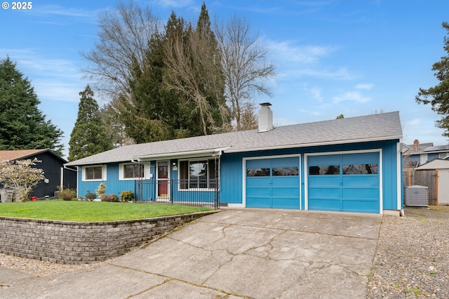 ranch-style house featuring a front yard, central AC unit, driveway, a chimney, and a garage