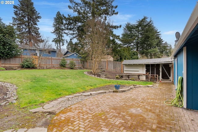 view of yard with a patio area and a fenced backyard