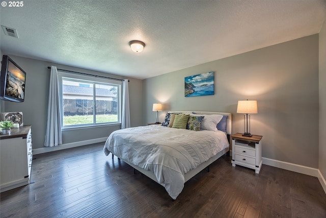 1852 SE Oar Dr, Lincoln City, OR 97367 - bedroom with baseboards, hardwood / wood-style flooring, and a textured ceiling