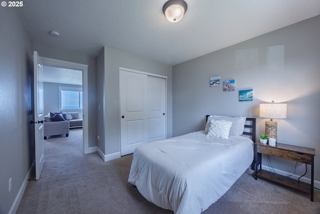 1852 SE Oar Dr, Lincoln City, OR 97367 - bedroom featuring baseboards, carpet, and a closet