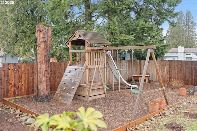 view of jungle gym with a fenced backyard