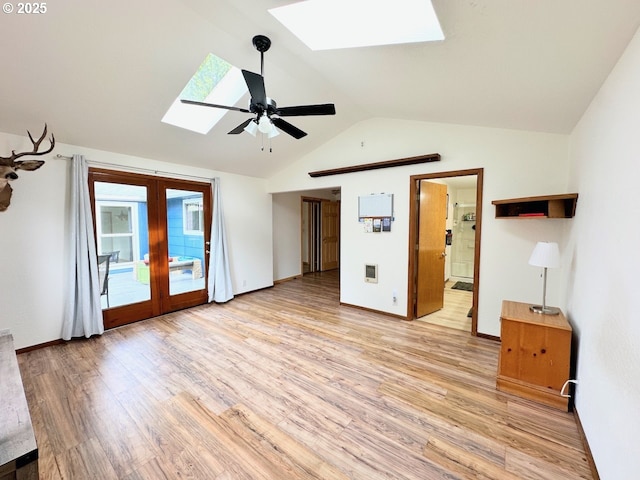 38434 Mckenzie Hwy, Springfield, OR 97478 - unfurnished bedroom featuring a skylight, access to outside, light wood-style flooring, lofted ceiling, and french doors