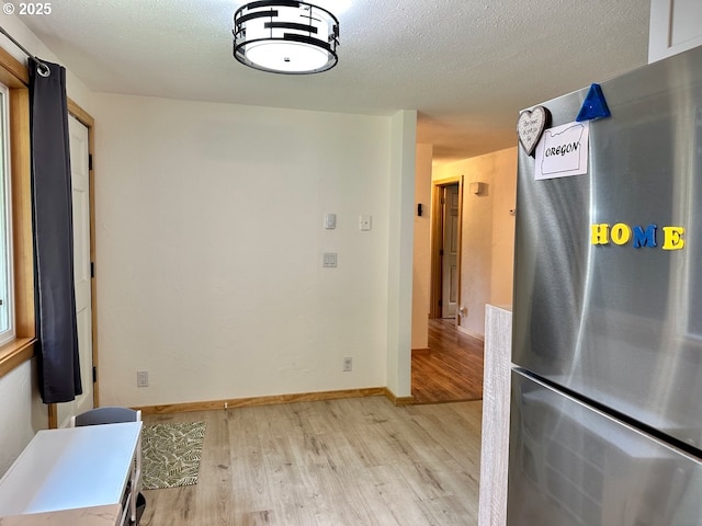 38434 Mckenzie Hwy, Springfield, OR 97478 - unfurnished dining area with light wood-style floors and baseboards