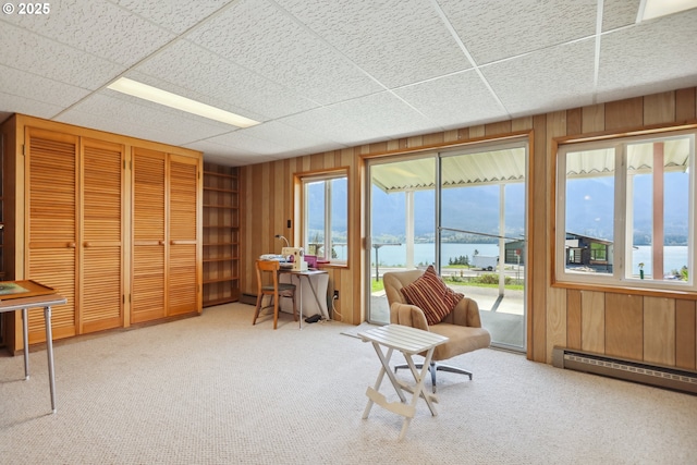 178 NE Tari Ln, Stevenson, WA 98648 - sitting room featuring wooden walls, a healthy amount of sunlight, and a water view