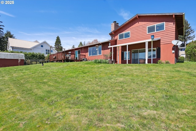 178 NE Tari Ln, Stevenson, WA 98648 - back of house featuring a lawn, a wooden deck, and a chimney