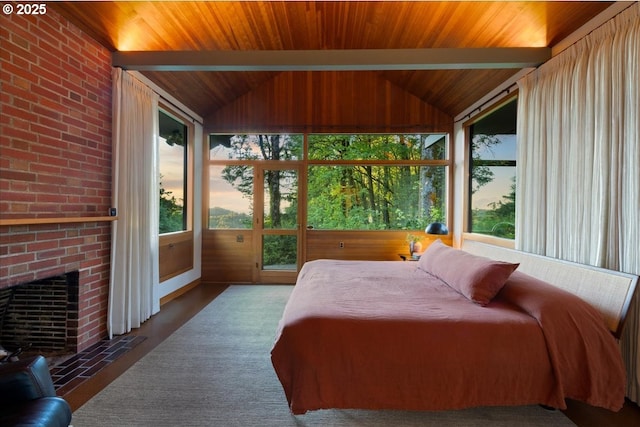 321 NW Hilltop Dr, Portland, OR 97210 - bedroom with wooden ceiling, a brick fireplace, and access to outside