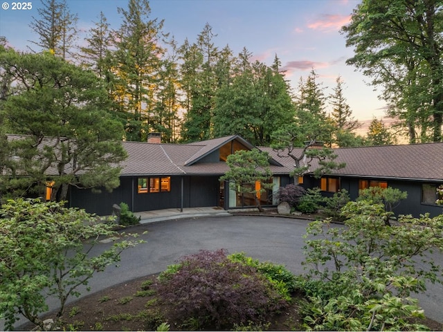 321 NW Hilltop Dr, Portland, OR 97210 - mid-century inspired home with a chimney and driveway