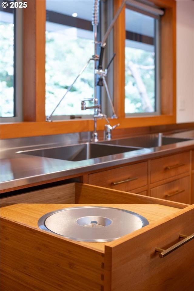 321 NW Hilltop Dr, Portland, OR 97210 - kitchen featuring stainless steel countertops, plenty of natural light, and a sink