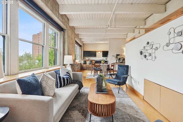 416 NW 13th Ave Unit 312, Portland, OR 97209 - living area featuring wood finished floors and wooden ceiling with exposed beams